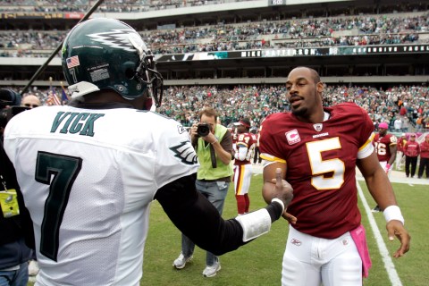 Redskins quarterback McNabb is greeted by Eagles quarterback Vick before the start of their NFL football game in Philadelphia Pennsylvania