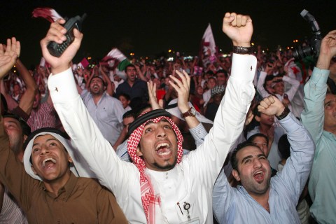 Qatari fans celebrate at Aspire Park in Doha after the announcement that Qatar will host the 2022 World Cup