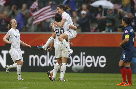 Players of the U.S. celebrate victory after the Women's World Cup semi-final soccer match against France in Monchengladbach