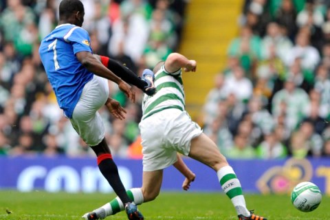 Rangers' Edu challenges Celtic's Brown during their Scottish Premier League soccer match at Parkhead Stadium in Glasgow