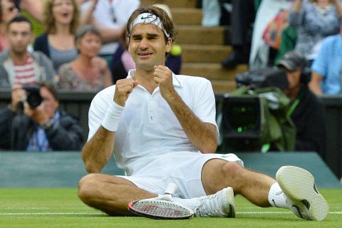 Roger Federer of Switzerland celebrates after defeating Andy Murray of Britain in their men's final tennis match at the Wimbledon Tennis Championships in London