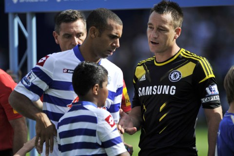 Anton Ferdinand avoids shaking hands with Chelsea's English defender John Terry