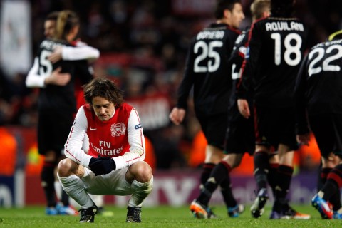 Tomas Rosicky of Arsenal reacts after the team was defeated by AC Milan in their Champions League last 16 second leg soccer match in London