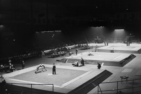 The eliminating rounds of the Greco-Roman Wrestling events take place at Empress Hall, Earl's Court, during the London Olympics, Aug. 4, 1948. 