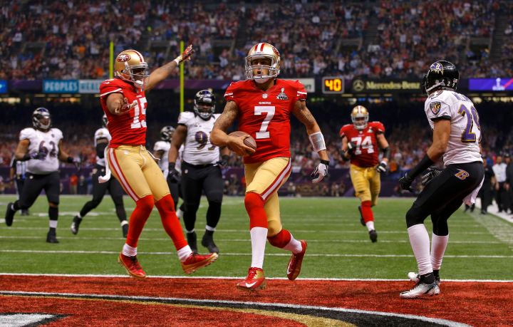 San Francisco 49ers quarterback Colin Kaepernick runs for a 15-yard fourth quarter touchdown against the Baltimore Ravens in the NFL Super Bowl XLVII football game in New Orleans, Feb. 3, 2013.