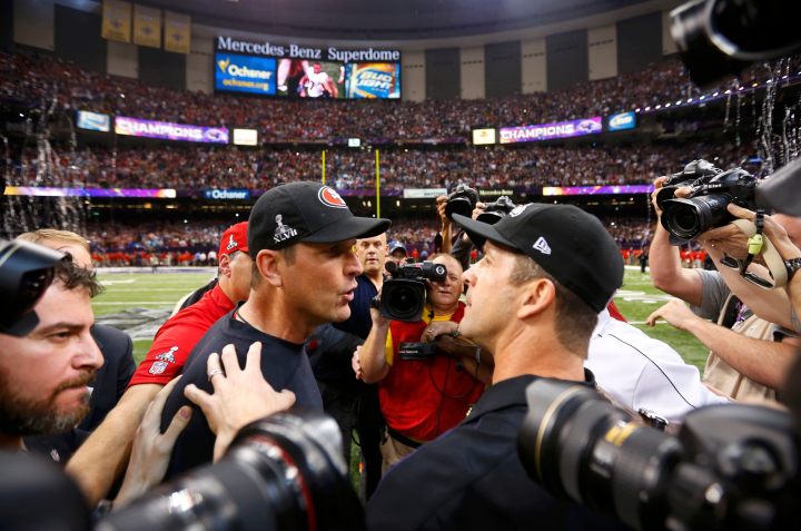 San Francisco 49ers head coach Jim Harbaugh, left, congratulates his brother and Baltimore Ravens head coach John Harbaugh after the Ravens defeated the 49ers to win the NFL Super Bowl XLVII football game in New Orleans, Feb. 3, 2013. 