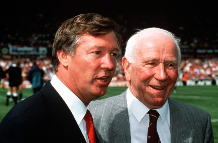 From right: Legendary former Manchester United Manager Sir Matt Busby meets with current United Manager Alex Ferguson, in 1991.