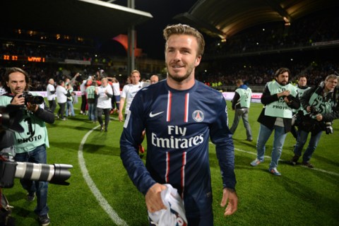 Paris' British midfielder David Beckham celebrates after Paris Saint-Germain won the French L1 title on May 12, 2013 at the Gerland stadium in Lyon, France.