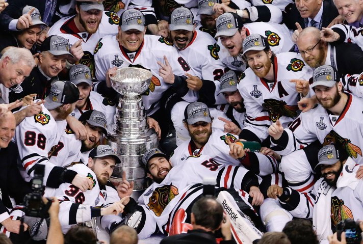 The Chicago Blackhawks pose with the Stanley Cup after beating the Boston Bruins 3-2 in Game 6 of the NHL hockey Stanley Cup Finals, on June 24, 2013, in Boston.