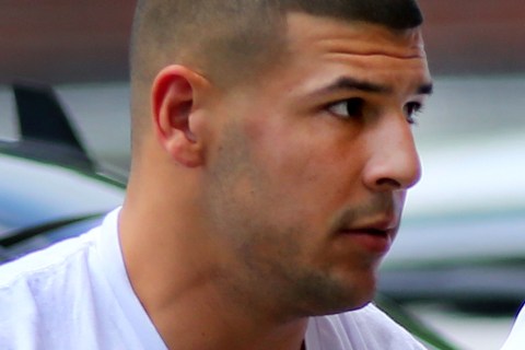 Former patriots player Aaron Hernandez is brought into Attleboro District Court  in Attleboro, Mass., on June 26, 2013.