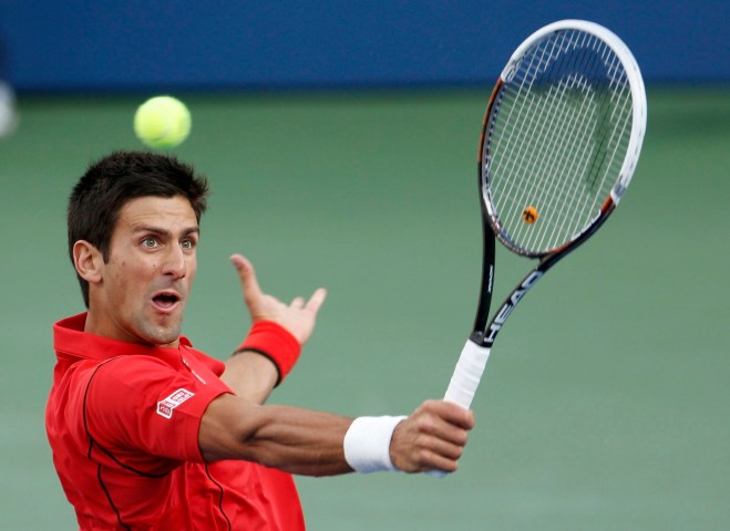 Djokovic of Serbia hits a return to Nadal of Spain during their men's final match at the U.S. Open tennis championships in New York