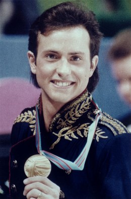 In this Feb. 20, 1988 file photo, figure skater Brian Boitano shows off his Olympic gold medal, in Calgary, Alberta.