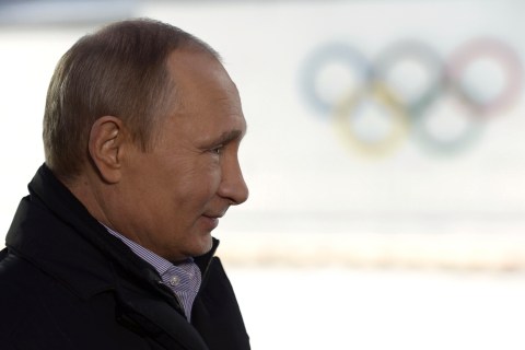 Russian President Putin listens to a journalist's question during a televised news conference in Sochi