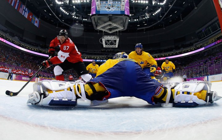 Canada's Crosby scores on a breakaway past Sweden's goalie Lundqvist during the second period of their men's ice hockey gold medal game at the Sochi 2014 Winter Olympic Games