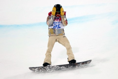 Shaun White of the U.S. reacts after crashing during the men's snowboard halfpipe final event at the 2014 Sochi Winter Olympic Games in Rosa Khutor