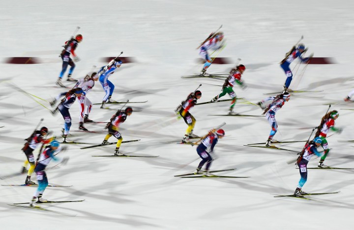 Skiers compete during the women's biathlon 12.5km mass start event at the Sochi 2014 Winter Olympic Games in Rosa Khutor