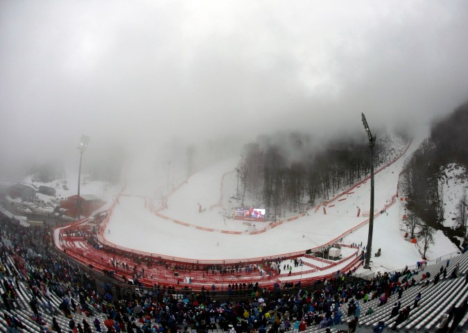 Fog blankets the finish area of the Alpine ski course during the second run in the women's giant slalom.