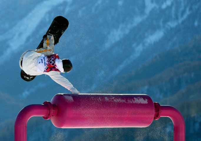 Sweden's Niklas Mattsson performs a jump during the men's slopestyle snowboarding qualifying session at the 2014 Sochi Olympic Games in Rosa Khutor
