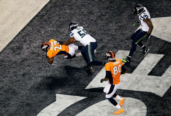 Running back Knowshon Moreno of the Denver Broncos recovers the ball in the endzone for a safety against the Seattle Seahawks during the first quarter.