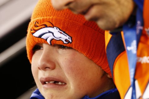 A young Denver fan cries during the second quarter of  Super Bowl XLVIII.