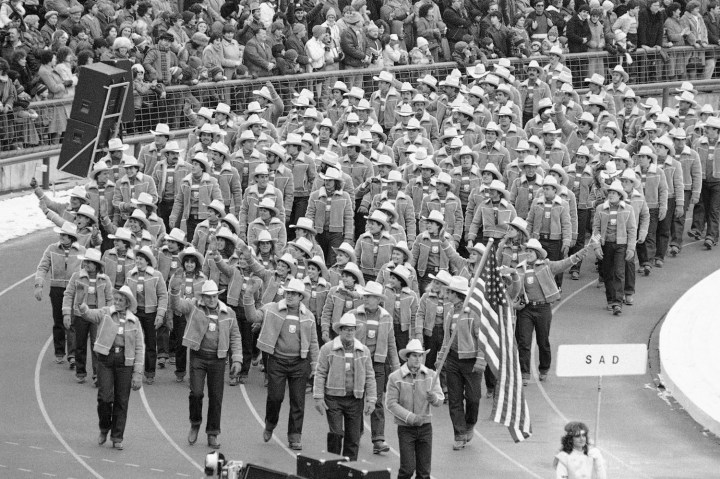 Luger Frank Masley carries the U.S. flag as he and his teammates march during the opening ceremonies of the 14th Winter Olympics in Sarajevo,Yugoslavia, Feb. 8, 1984. 