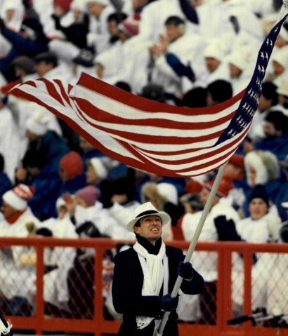 Lyle Nelson carries the flag during the opening of the 1988 Winter Olympics in Calgary, Aberta, Canada. 